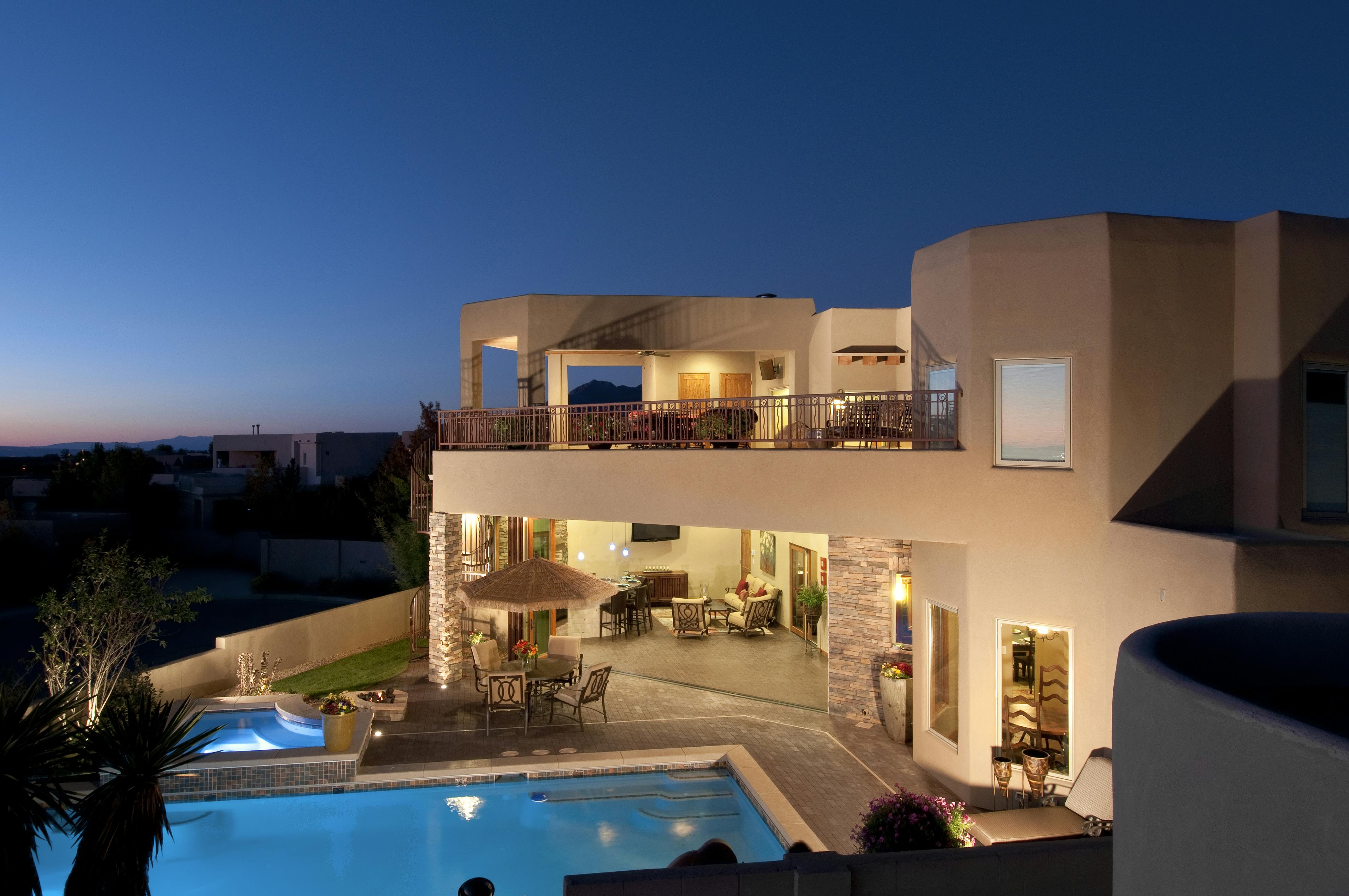 Custom hand-forged wrought iron &frac34;-inch picket railing surrounds the open-air bal