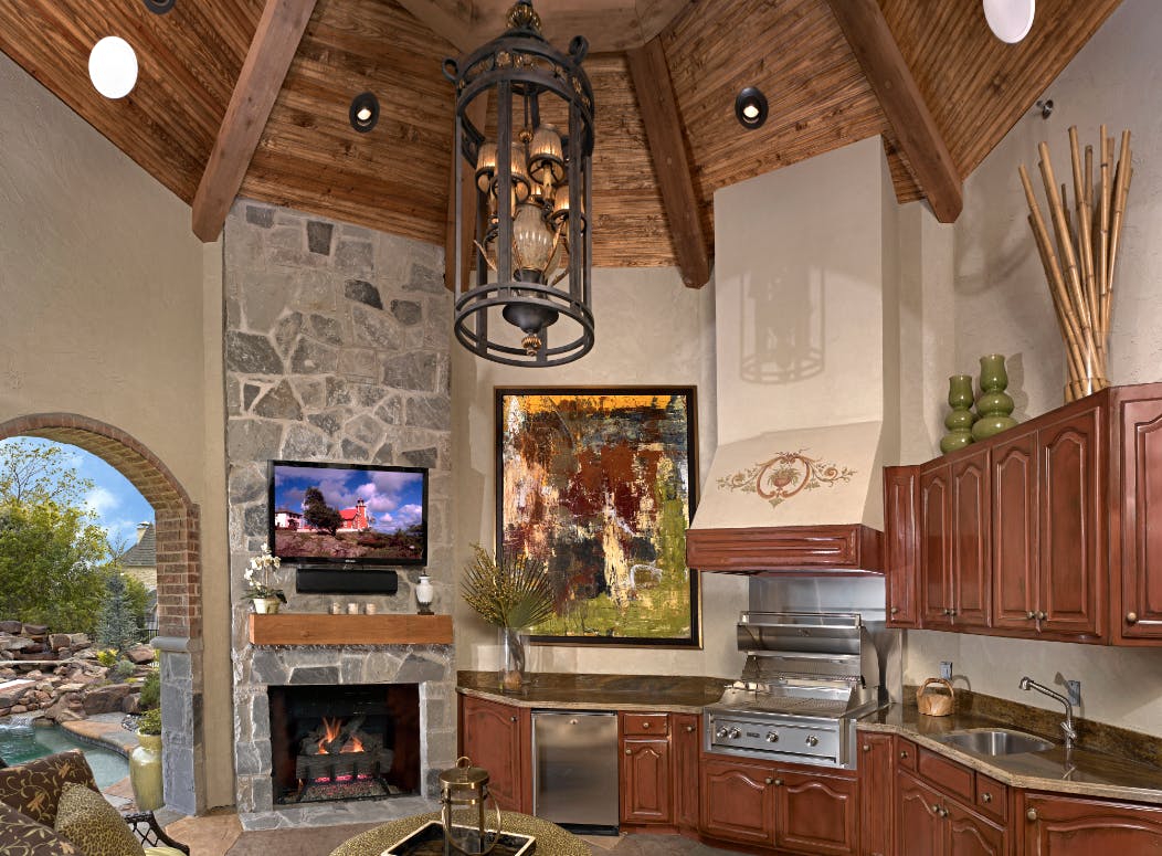 The highlight of the project remains the cabana outdoor kitchen with stone heart