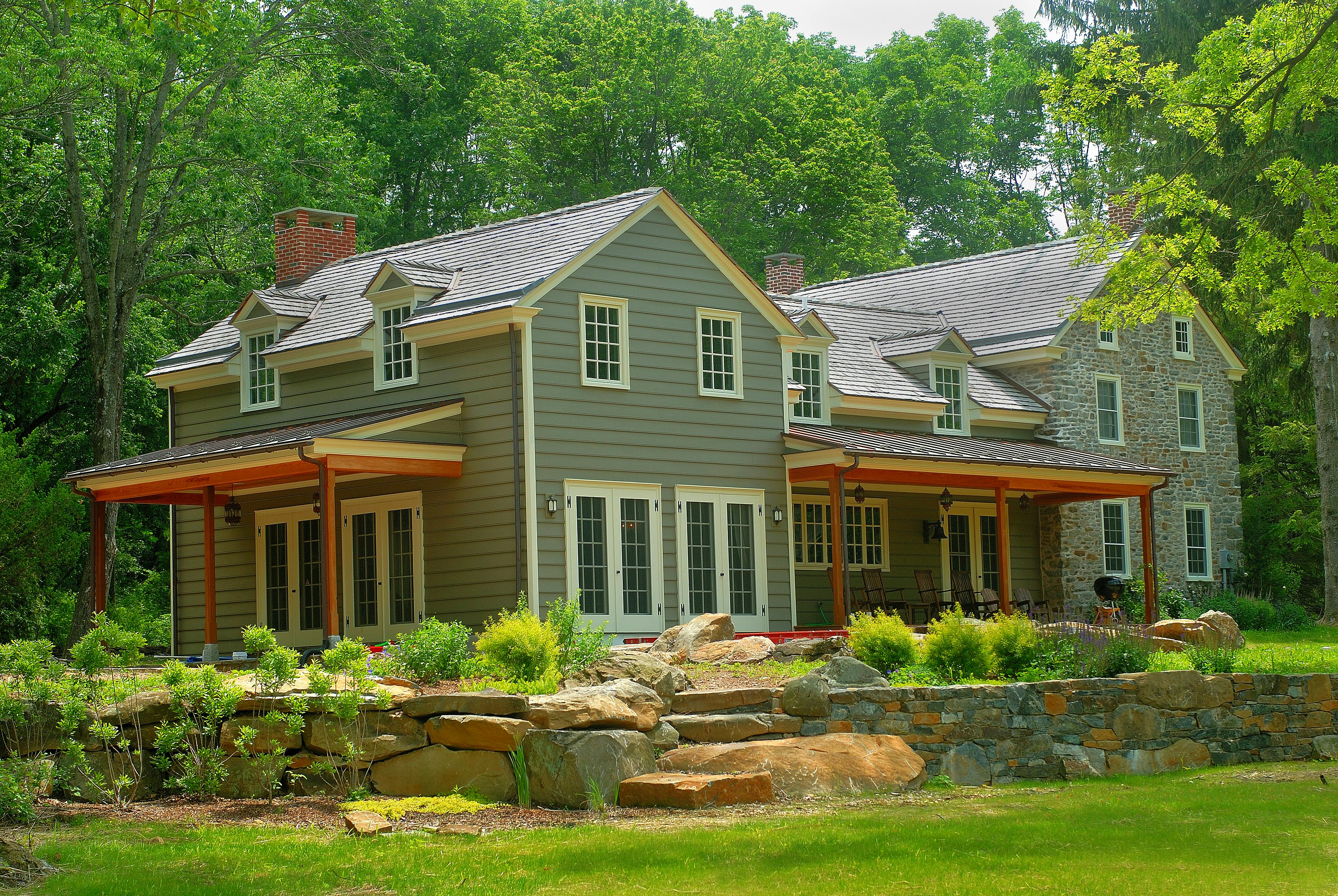 Dormers on the new addition ran through eaves, keeping its rooflines lower than
