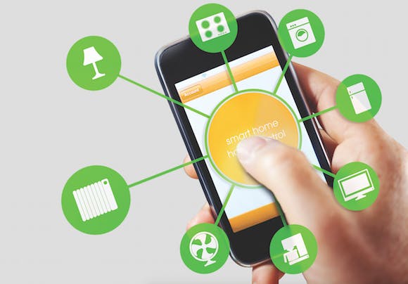 Hand using smart phone to control smart home devices from a smart phone