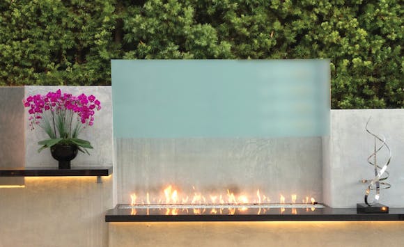 Fireplaces have long been a staple of outdoor room design, but more manufacturers are now making gas fireplaces for exterior use, dramatically altering the look of the space from rustic or transitional to a modern aesthetic.