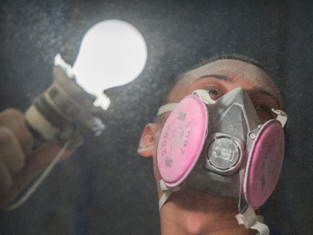 Worker with dust in the air on a jobsite. Photo: courtesy ITW