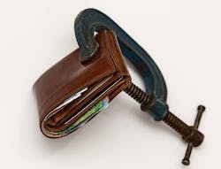 Wallet squeezed in a C-clamp Wallet squeezed in a C-clamp