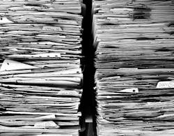 Paper forms in file cabinet Paper forms in file cabinet