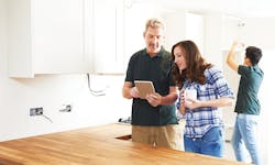 Remodelers discussing punch lists Remodelers discussing punch lists