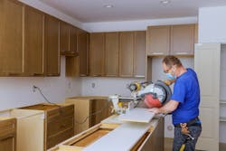 remodeler working in a home during the pandemic remodeler working in a home during the pandemic