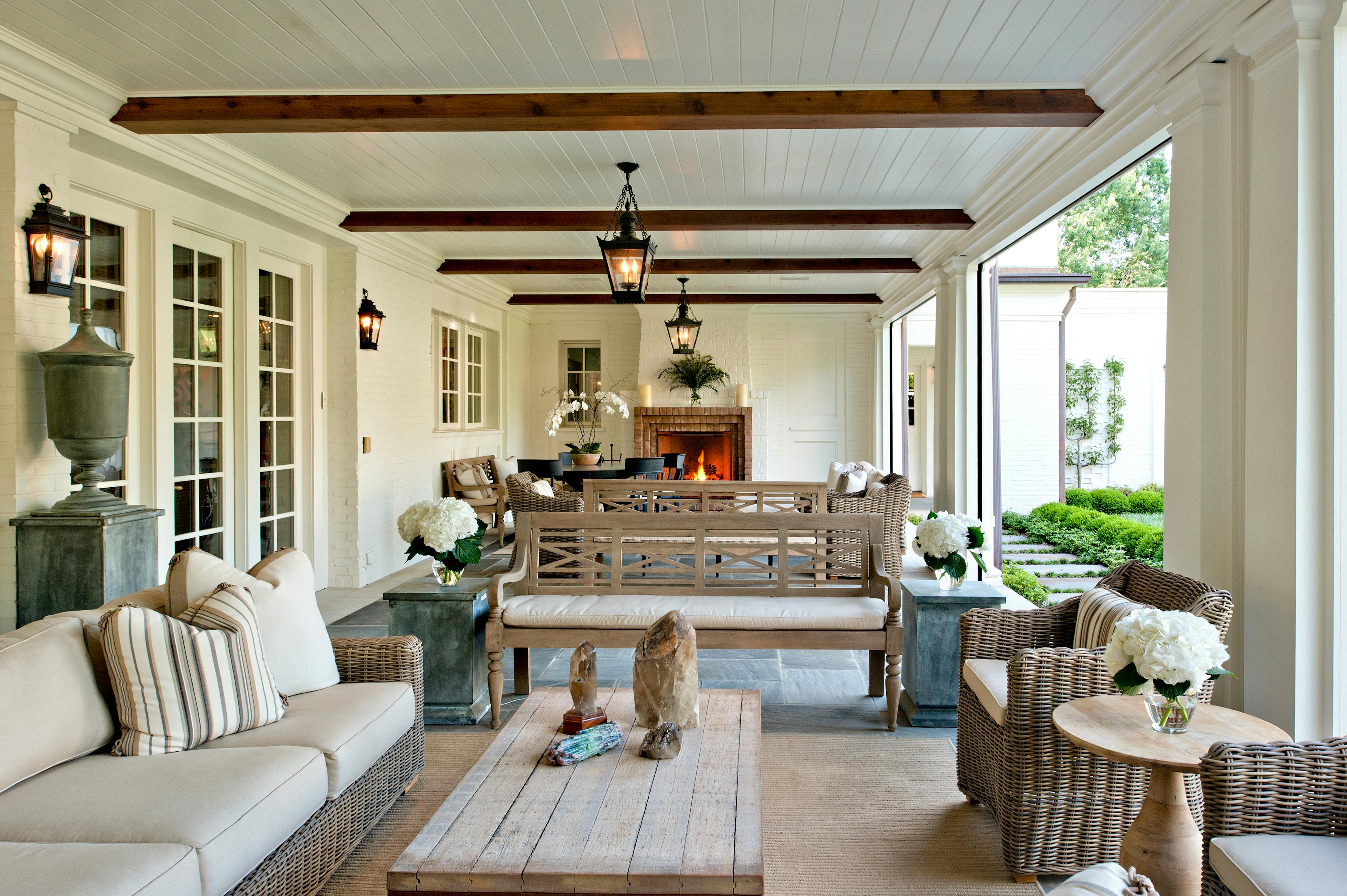 A new porch overlooking the grass courtyard serves as the homeowner&rsquo;s primary en