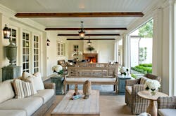 A new porch overlooking the grass courtyard serves as the homeowner’s primary en A new porch overlooking the grass courtyard serves as the homeowner’s primary en