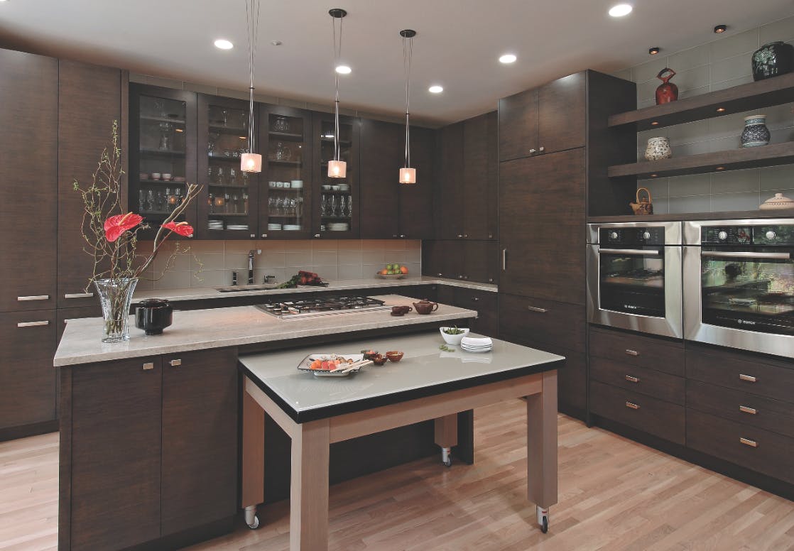 Ovens placed next to each other, rather than stacked, and placed at a comfortab