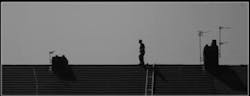 Man walking on roof Man walking on roof
