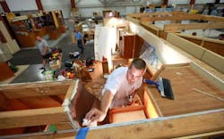 Setting up a booth for a home show Setting up a booth for a home show