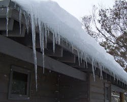 Severe ice damming on residential roof Severe ice damming on residential roof