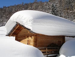 The snow on this roof is several feet deep, but how much snow is too much for a roof and threatens roof collapse? The snow on this roof is several feet deep, but how much snow is too much for a roof and threatens roof collapse?