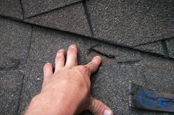 Close-up photo of asphalt shingle roof repair Close-up photo of asphalt shingle roof repair