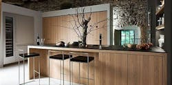 Modern rustic kitchen with stainless steel, wood, and stone. Modern rustic kitchen with stainless steel, wood, and stone.