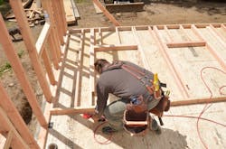 Carpenter Ben Bogie framing the walls of the model remodel project Carpenter Ben Bogie framing the walls of the model remodel project