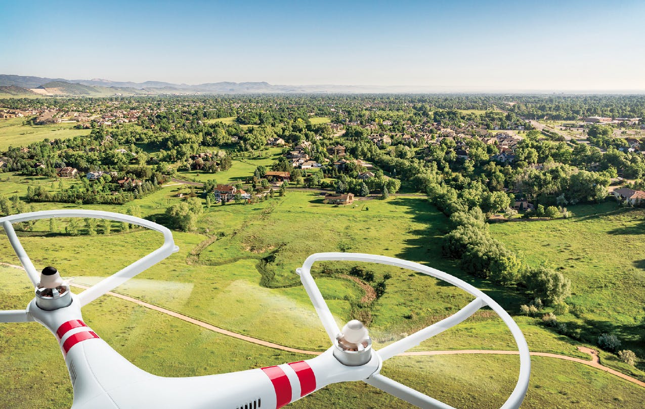 drone flying over homes being remodeled