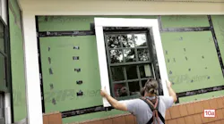 ben bogie putting in a window