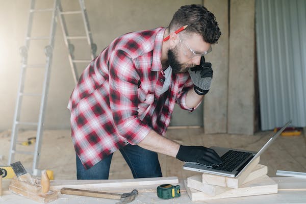 man reading emails and on phone