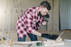 man reading emails and on phone man reading emails and on phone