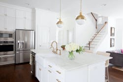 white kitchen with island, pendant lights, and cabinetry white kitchen with island, pendant lights, and cabinetry
