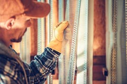 Contractor Picking out Drywall Contractor Picking out Drywall