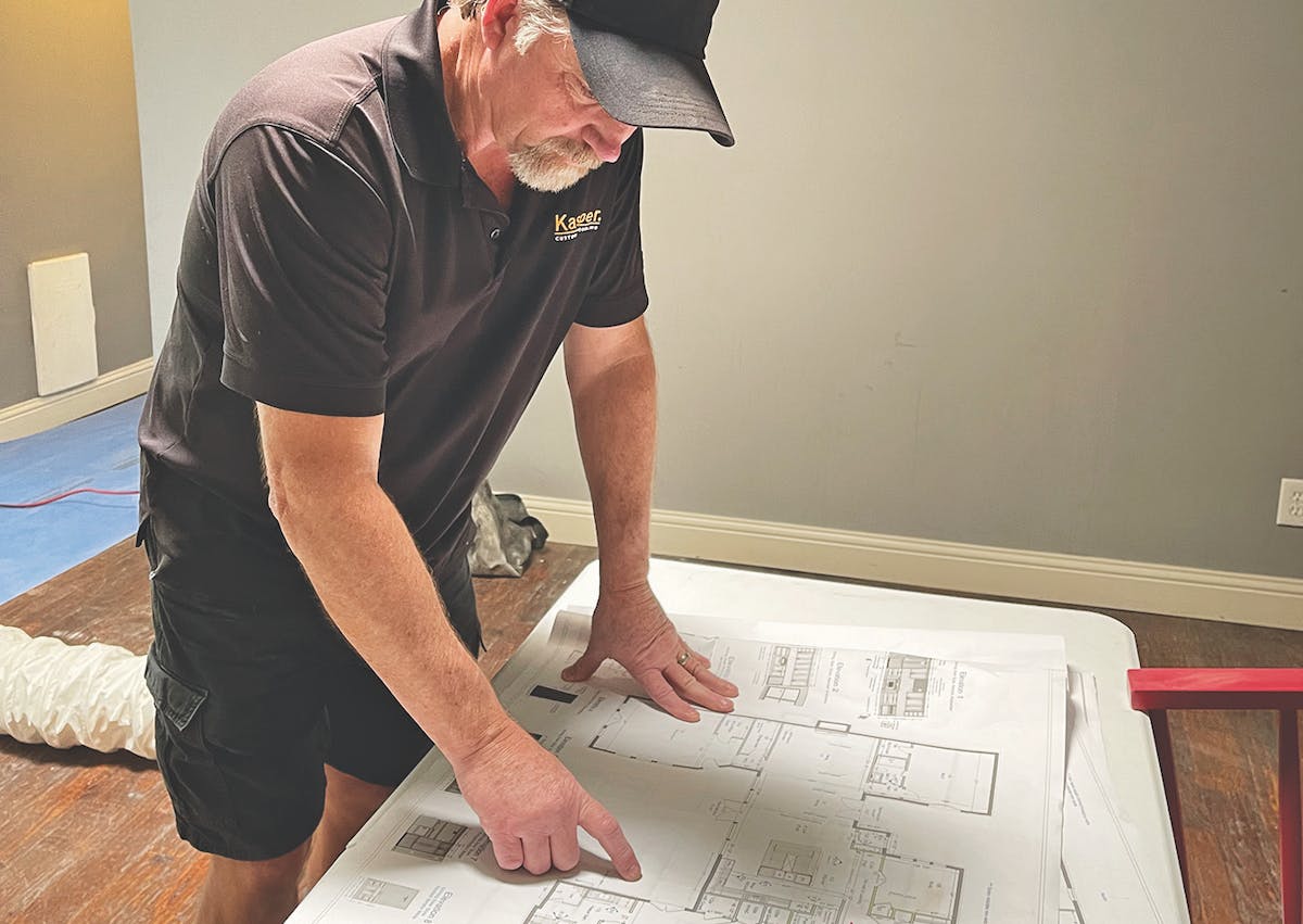 project construction manager reviewing plans