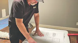 project construction manager reviewing plans
