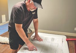 project construction manager reviewing plans project construction manager reviewing plans