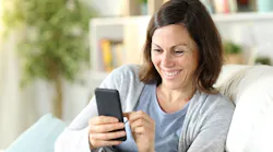 Woman receiving a text message from a contractor