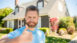 Satisfied home improvement customer giving thumbs up