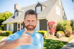 Satisfied home improvement customer giving thumbs up Satisfied home improvement customer giving thumbs up