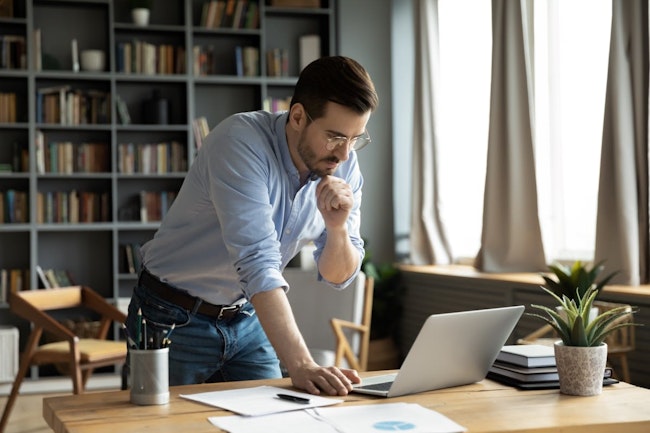Man pondering difficult decisions