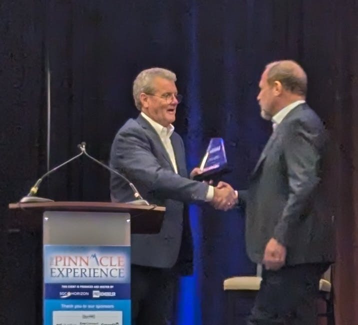 Brian Gottlieb receives the Remodeling Mastery Award from Mark Richardson