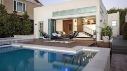 Home that utilizes Andersen Folding Outswing doors to expand indoor / outdoor living