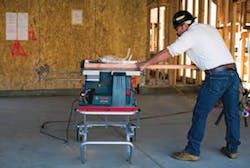 The Reaxx portable table saw in use. The Reaxx portable table saw in use.