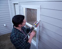 Application of Quad Max caulk to an exterior window. Application of Quad Max caulk to an exterior window.