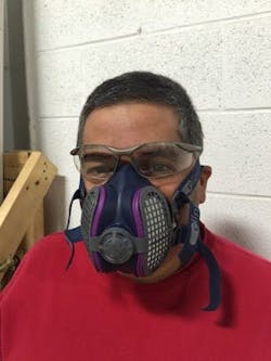 Worker wearing half-face respirator Worker wearing half-face respirator
