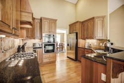 A kitchen with high countertops that may or may not be suitable for aging-in-place design A kitchen with high countertops that may or may not be suitable for aging-in-place design