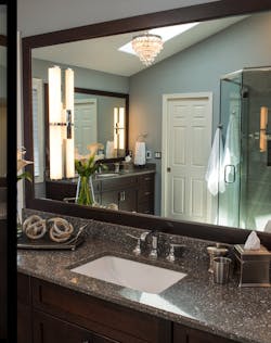 New vanity mirror in 1980s remodeled bathroom New vanity mirror in 1980s remodeled bathroom