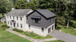 Cornerstone Remodeling added a large primary suite over their client's existing garage. The big challenge was designing the exterior so it kept the original home's charm and curb appeal. Photo: Cornerstone Remodeling.