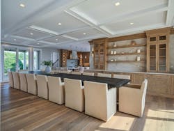 Every aspect of the massive remodel had its own challenges, but the kitchen area may have been the most formidable. The clients requested an open space, and so two structural beams were added to replace load bearing walls. Weighing in at as much as 1,000 lbs., each beam required 12 people to carry it inside. The state-of-the art kitchen is now accompanied by a large dining area with coffered ceilings and counter for buffet-style gatherings. Every aspect of the massive remodel had its own challenges, but the kitchen area may have been the most formidable. The clients requested an open space, and so two structural beams were added to replace load bearing walls. Weighing in at as much as 1,000 lbs., each beam required 12 people to carry it inside. The state-of-the art kitchen is now accompanied by a large dining area with coffered ceilings and counter for buffet-style gatherings.