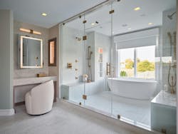 Every aspect of the reimagined home exudes luxury and thoughtful design. A small shower and platform tub were replaced by a wetroom with dual shower stations, heated floors, and a soaking tub. Every aspect of the reimagined home exudes luxury and thoughtful design. A small shower and platform tub were replaced by a wetroom with dual shower stations, heated floors, and a soaking tub.