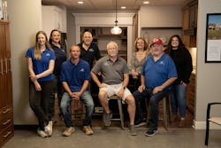 Mike Pressgrove, center, with his team Mike Pressgrove, center, with his team