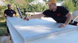 Adhesive Seals The Panels To The Framing After Snapping Lines Indicating Framing Members, The Crew Applies Foam Subfloor Adhesive To Assure A Solid Bond While Waiting For Closed Cell Spray Foam To Be Added To Joist Cavities From Above Adhesive Seals The Panels To The Framing After Snapping Lines Indicating Framing Members, The Crew Applies Foam Subfloor Adhesive To Assure A Solid Bond While Waiting For Closed Cell Spray Foam To Be Added To Joist Cavities From Above