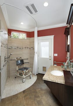 This first-floor guest bathroom was converted into an accessible space for the primary user. The new bathroom features a roll-in curbless shower, a roll-under vanity, and a wall-hung toilet. Clever storage maximizes independence and includes a floating shelf above the vanity and a pull-out cabinet for grooming products. This first-floor guest bathroom was converted into an accessible space for the primary user. The new bathroom features a roll-in curbless shower, a roll-under vanity, and a wall-hung toilet. Clever storage maximizes independence and includes a floating shelf above the vanity and a pull-out cabinet for grooming products.