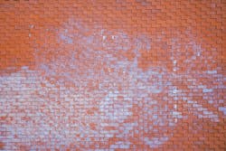efflorescence on a brick wall efflorescence on a brick wall