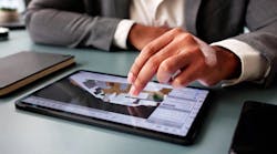 person working with design program on tablet person working with design program on tablet