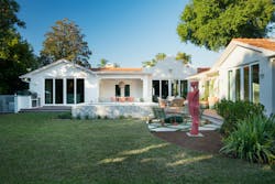 A new parapet carries the home’s tropical Miami aesthetic to the rear facade. An old covered porch was removed at the back (below) and replaced with a smaller one more consistent with the home’s scale. A new parapet carries the home’s tropical Miami aesthetic to the rear facade. An old covered porch was removed at the back (below) and replaced with a smaller one more consistent with the home’s scale.
