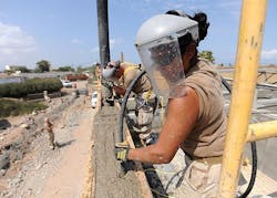 US Navy Builder Constructionmen Diana Aceves, right, and Daniel Fuentes vibrate concrete as part of a Naval Mobile Construction Battalion. US Navy Builder Constructionmen Diana Aceves, right, and Daniel Fuentes vibrate concrete as part of a Naval Mobile Construction Battalion.